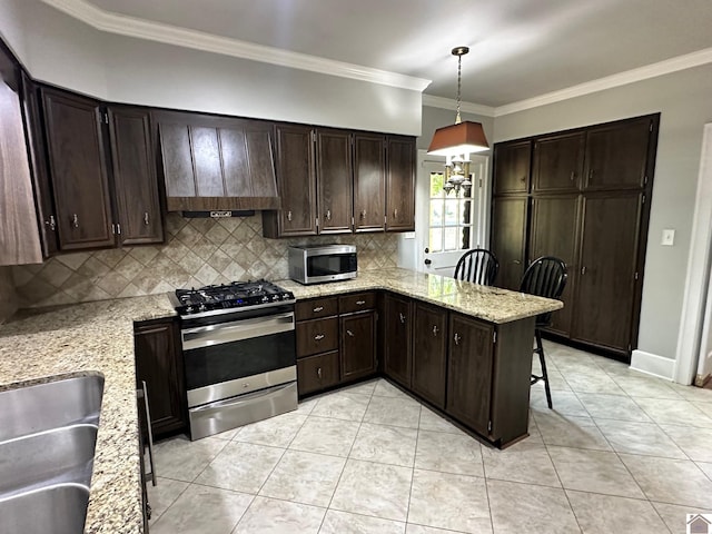 kitchen featuring dark brown cabinetry, decorative backsplash, appliances with stainless steel finishes, light stone countertops, and light tile patterned flooring