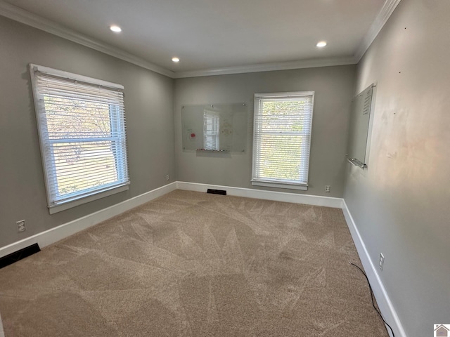 carpeted spare room featuring ornamental molding, recessed lighting, visible vents, and baseboards