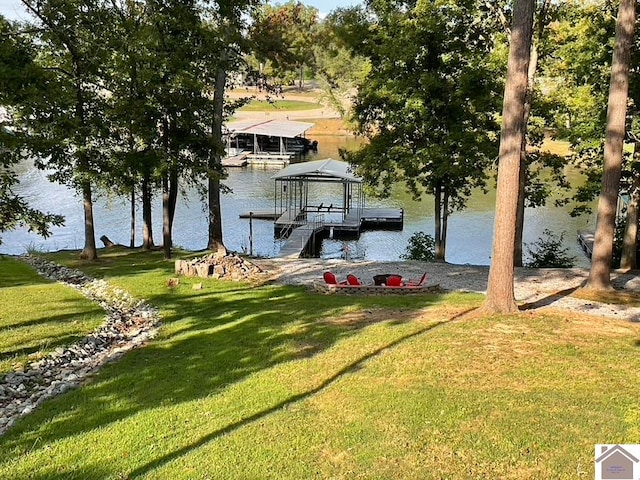 dock area featuring a yard and a water view