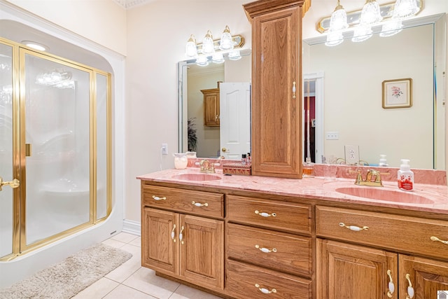 bathroom with tile patterned flooring, vanity, and an enclosed shower