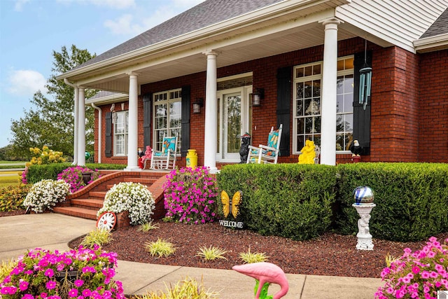 doorway to property featuring covered porch