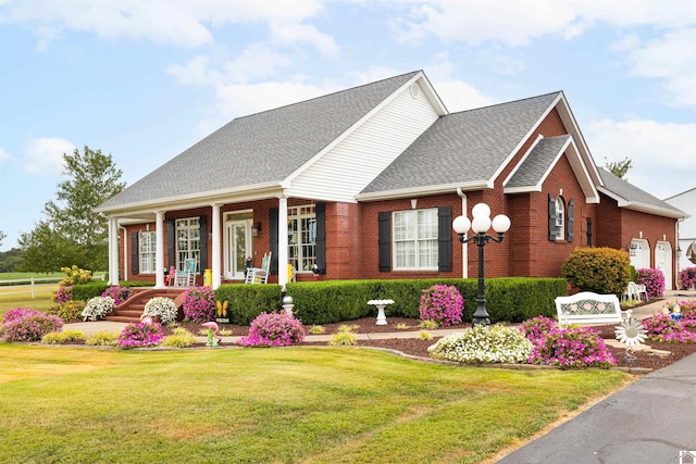 view of front facade featuring a front yard and a porch