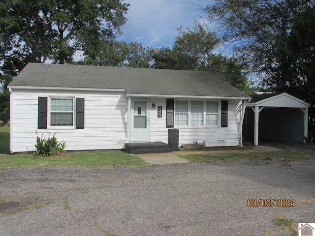 view of front of property with a carport