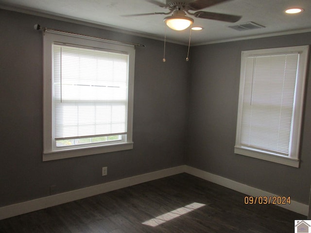 empty room featuring ceiling fan, crown molding, and wood-type flooring