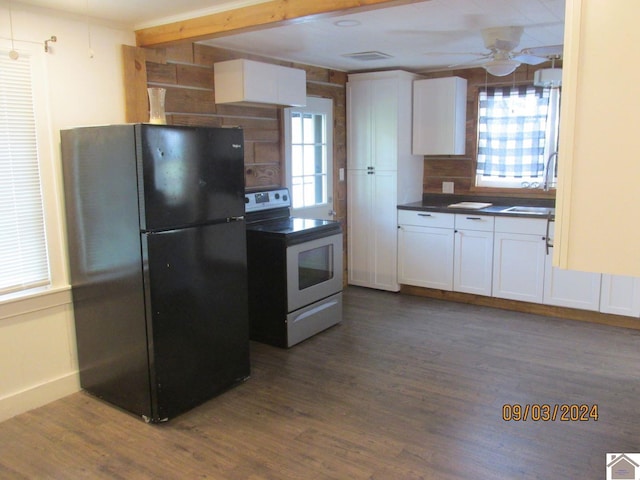 kitchen with black fridge, white cabinets, ceiling fan, and range with electric cooktop