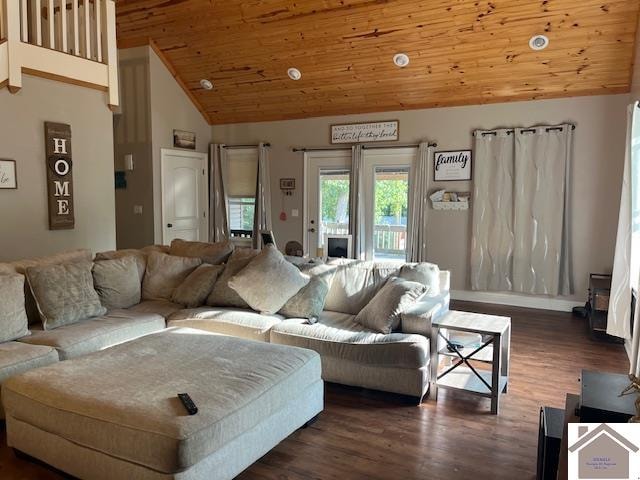 living room featuring vaulted ceiling, dark hardwood / wood-style floors, and wooden ceiling