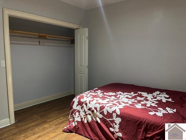 bedroom with a closet and light hardwood / wood-style flooring