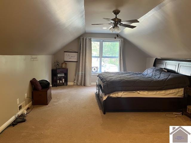 bedroom featuring light carpet, vaulted ceiling, and ceiling fan