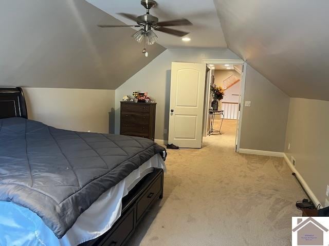 bedroom featuring light carpet, vaulted ceiling, and ceiling fan