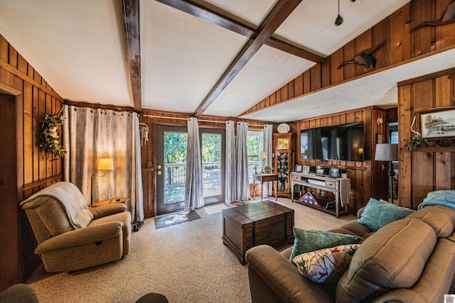 living room featuring carpet flooring, wooden walls, and vaulted ceiling with beams