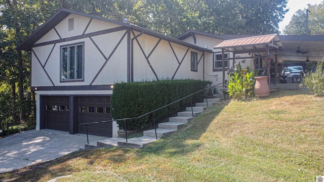 view of front of house featuring a front yard and a garage