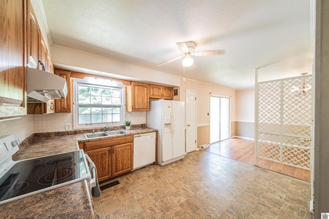 kitchen featuring ceiling fan with notable chandelier, white appliances, sink, extractor fan, and ornamental molding