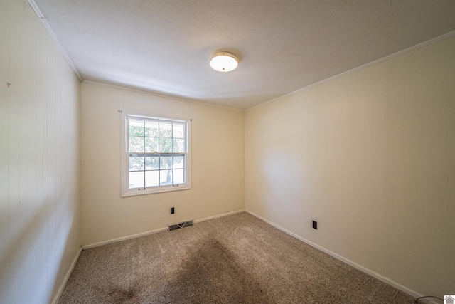 unfurnished room with carpet and ornamental molding