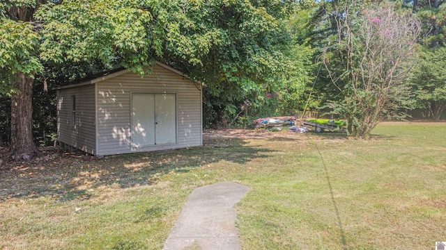 view of outdoor structure with a yard