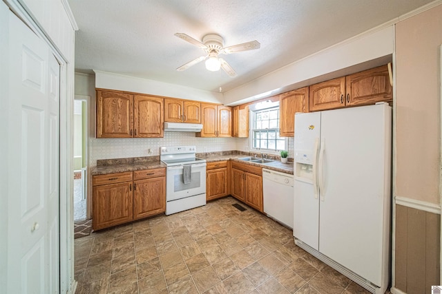 kitchen featuring white appliances, sink, ceiling fan, and a textured ceiling