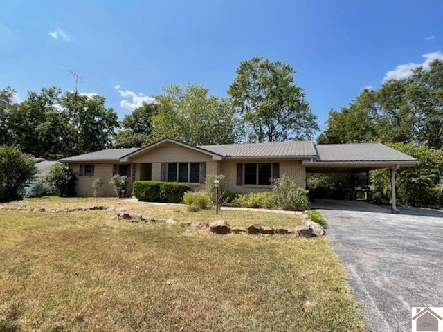 single story home with a front lawn and a carport