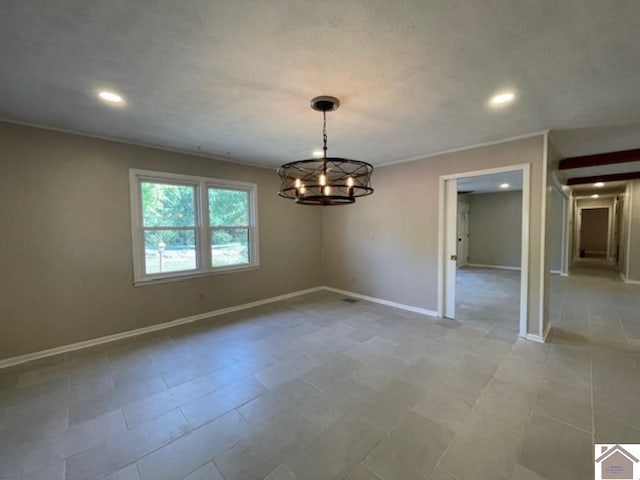 empty room featuring crown molding, an inviting chandelier, and light tile patterned flooring