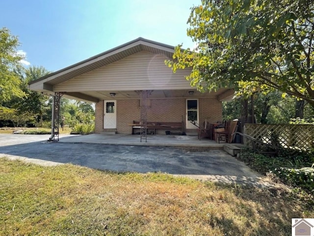 rear view of house with a lawn