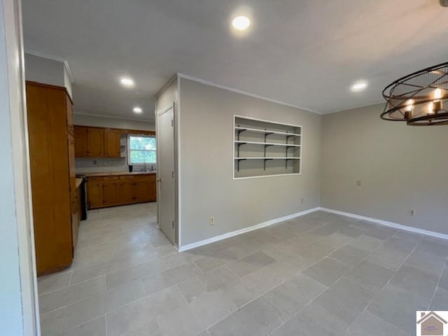 unfurnished living room featuring ornamental molding, built in features, light tile patterned floors, and sink