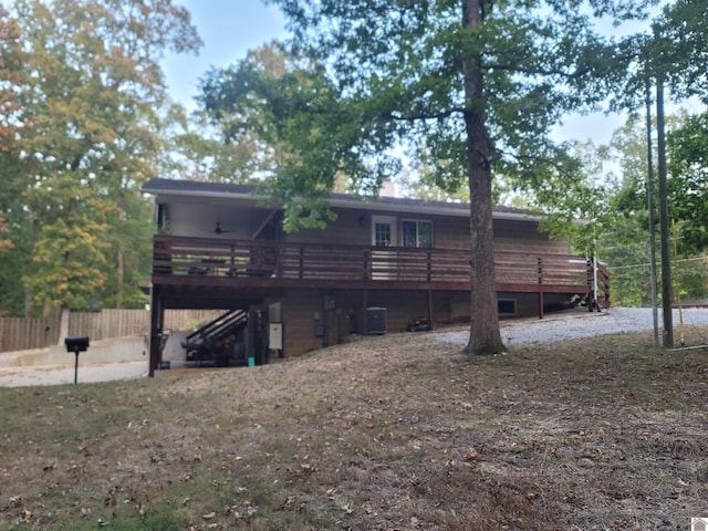 rear view of house featuring a deck