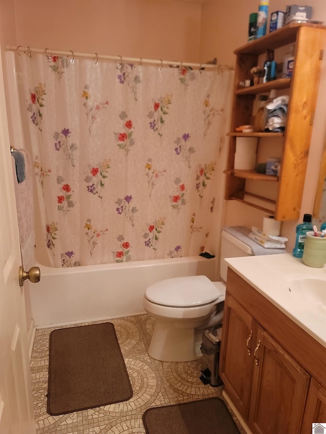 full bathroom with tile patterned floors, toilet, shower / tub combo with curtain, and vanity