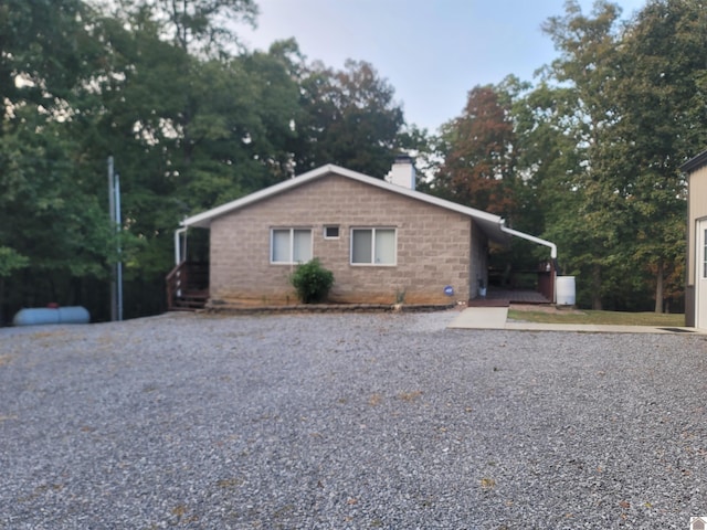 exterior space with a carport