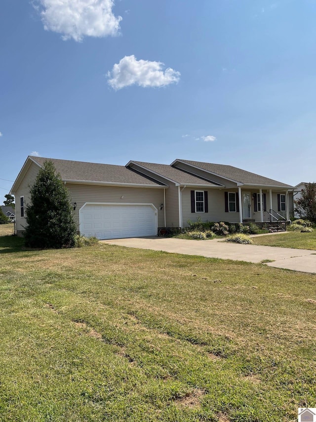 ranch-style house featuring a garage, a front lawn, and a porch