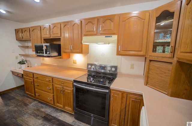 kitchen featuring stainless steel appliances and decorative backsplash