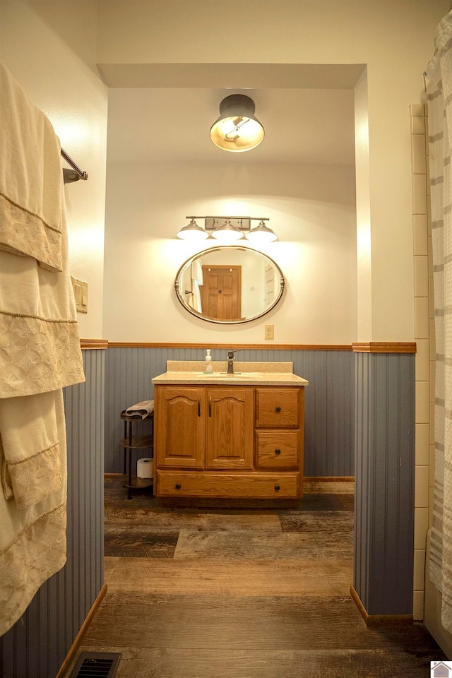 bathroom featuring vanity and hardwood / wood-style floors