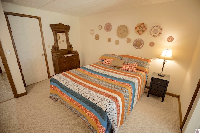 bedroom featuring light carpet