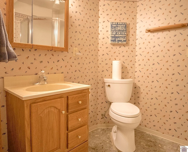 bathroom featuring tile patterned flooring, vanity, and toilet