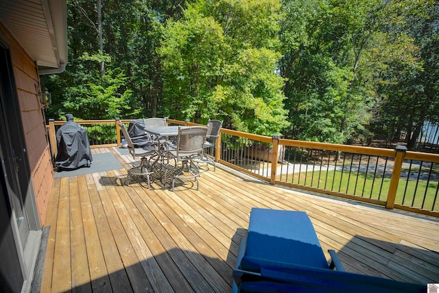 wooden terrace with a yard