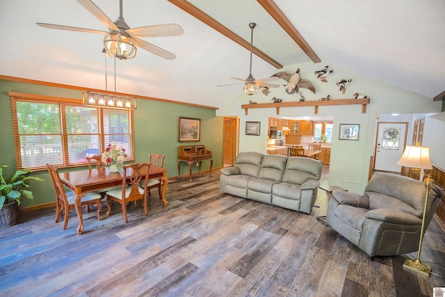 living room featuring hardwood / wood-style floors, ceiling fan, and vaulted ceiling with beams