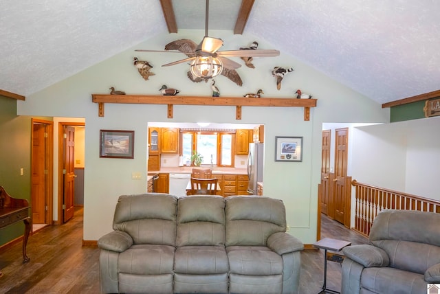 living room with a textured ceiling, ceiling fan, hardwood / wood-style floors, and lofted ceiling with beams