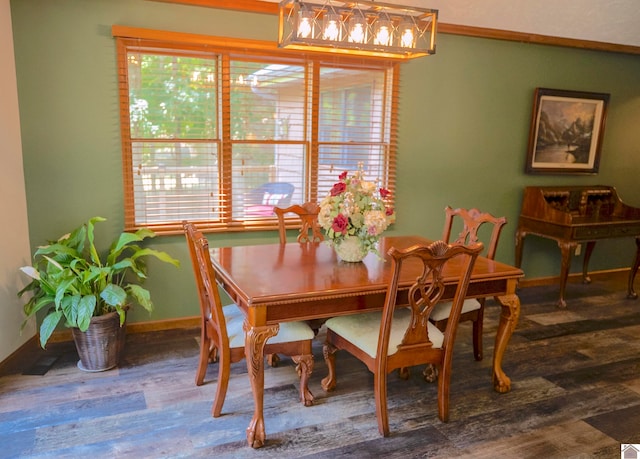 dining space with wood-type flooring