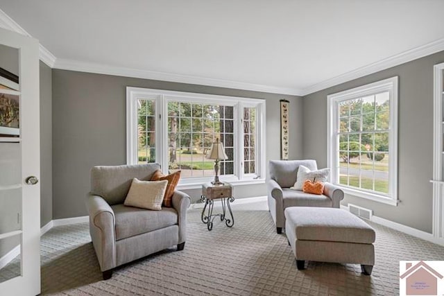 living area with light colored carpet, ornamental molding, and a wealth of natural light