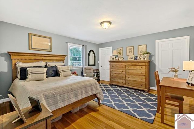 bedroom with wood-type flooring