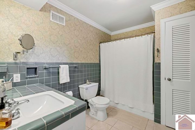 bathroom with walk in shower, tile patterned floors, ornamental molding, vanity, and toilet