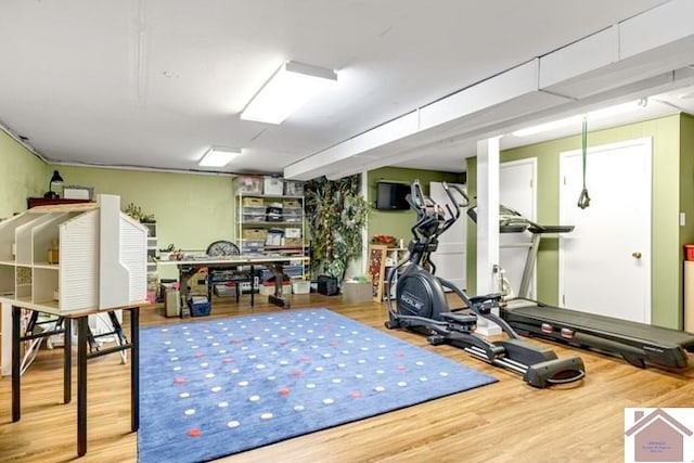 workout room with light wood-type flooring