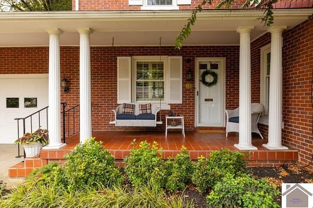 property entrance featuring a porch and a garage