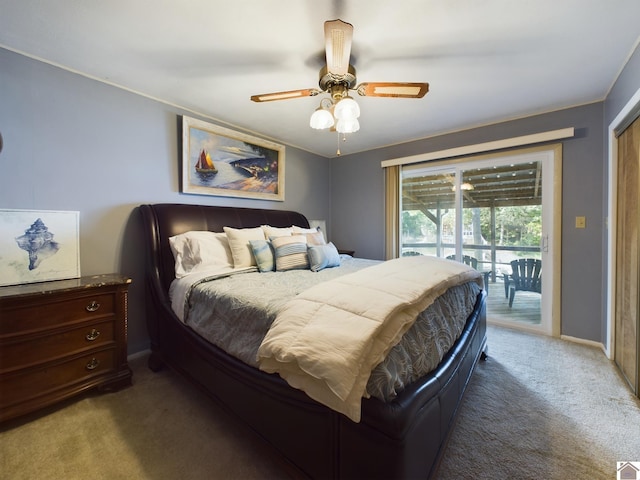 bedroom with dark carpet, ceiling fan, and access to exterior