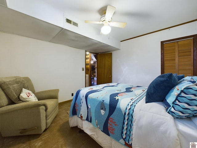 carpeted bedroom with ceiling fan and a closet