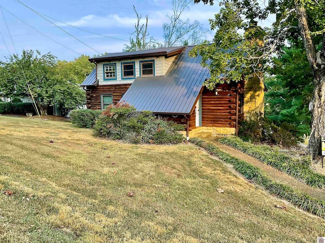 view of property exterior featuring a lawn