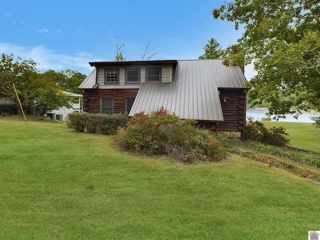 546 Blue Sprigs Blvd, Cadiz, KY 42211 - back of property with log siding, metal roof, a chimney, and a yard