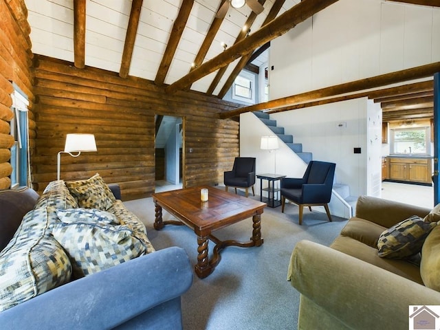 living room featuring beamed ceiling, sink, high vaulted ceiling, light carpet, and rustic walls