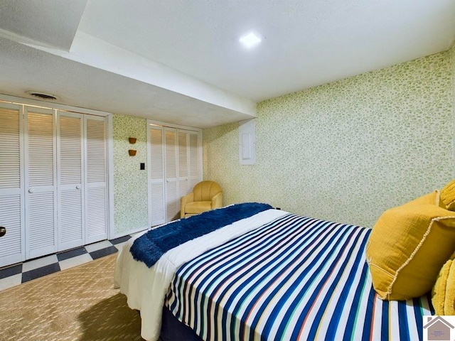 bedroom featuring two closets