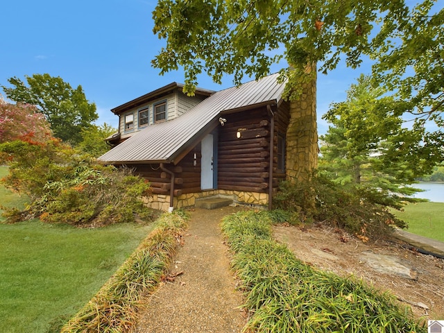 log-style house with a front yard