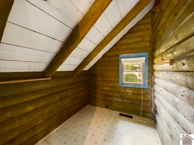 additional living space featuring vaulted ceiling with beams, wooden walls, and wood ceiling