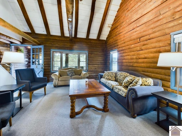 carpeted living room with high vaulted ceiling, wood ceiling, rustic walls, and beamed ceiling