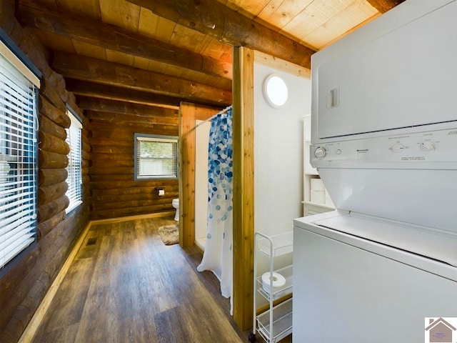 laundry room featuring wooden ceiling, stacked washer / drying machine, log walls, and dark hardwood / wood-style flooring